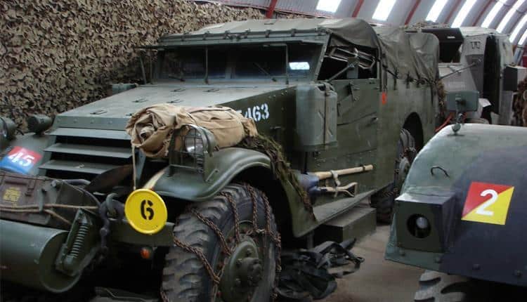 Historic military vehicle displayed with other military equipment